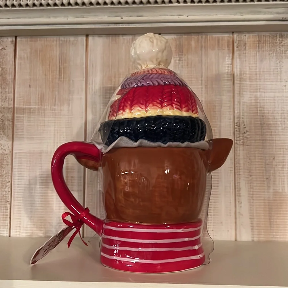 NWT blue sky, handcrafted, reindeer mug. It‎ has the lid on it,